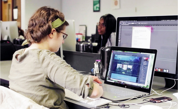 Woman using laptop and computer