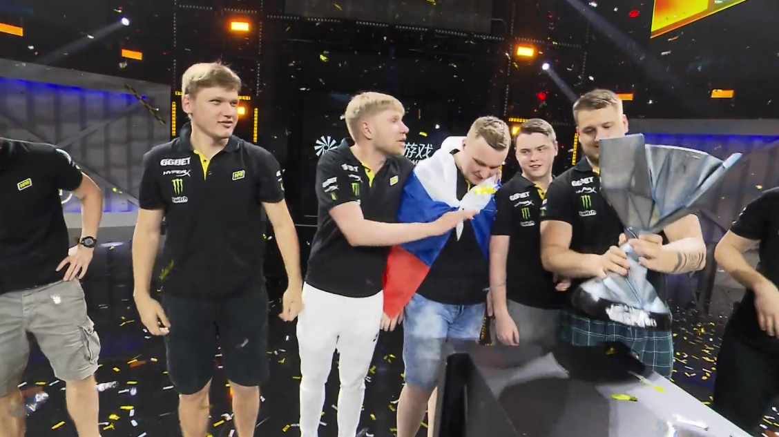 Team celebrates with esports trophy